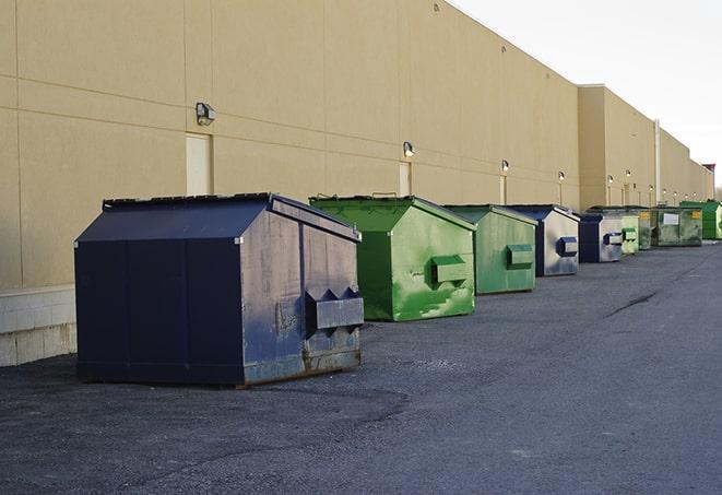 bright yellow construction dumpster full of discarded materials in Arlington